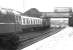 A downpour at Dumfries in 1972 as an EE Type 4 leaves the station with a train for the south passing 5378 standing on the centre road. The roof of the former Dumfries locomotive shed, closed approximately 7 years earlier, is visible just beyond St Mary's Street Bridge. <br><br>[John Furnevel 28/05/1972]