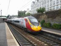 On certain summer Saturdays, in order to provide additional seating capacity, some Edinburgh - Birmingham services are worked by Pendolinos rather than Voyagers. One such example is the 14.52 departure from Edinburgh, seen here calling at Haymarket on 31 July 2010.<br><br>[Michael Gibb 31/07/2010]