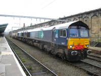 DRS 66417 and friend pause at Carlisle on 31 July with a nuclear flask train.<br><br>[Michael Gibb 31/07/2010]