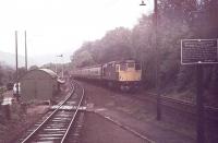 An Oban service runs in to Arrochar and Tarbet from the south behind an unidentified BRCW Class 27. At this time the station was still controlled by semaphore signals. [See image 30115] for a modern day view of the same location.<br><br>[Mark Bartlett 15/09/1977]
