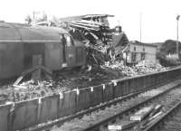 Mishap at Grantshouse. On 8 August 1961 EE Type 4 no D249 failed to stop after being routed into the up loop at Grantshouse, with the inevitable result shown here. The locomotive carried the scars for many years, including a different coloured front end. This may also have been the last occasion on which ECML trains were diverted via Kelso to Tweedmouth.  Taken on 9 August, the day after the mishap.<br>
<br><br>[Jim Peebles 09/08/1961]