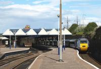 View east at Dundee station in August 2010. On the left a Glasgow Queen Street - Aberdeen service is preparing to restart its journey from platform 4, while on the right an Aberdeen - Kings Cross HST has just arrived at platform 1.<br><br>[Brian Forbes 05/08/2010]