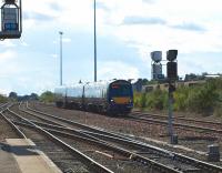 A Glasgow Queen Street - Aberdeen service runs downhill out of the sun towards Dundee station on 5 August, past the site of the old Dundee West signal box [see image 5942].<br>
<br><br>[Brian Forbes 05/08/2010]