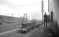 With EE Type 4 diesels dominating the background, WD Austerity 2-8-0 no 90396 takes a freight south west past Gateshead shed on 6 October 1962 between Greensfield and King Edward Bridge Junction. The Wakefield (56A) locomotive has a distinctly ex-works look about it. <br><br>[K A Gray 06/10/1962]