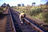 Gauging the track at Fearn in the summer of 1974 - the redundant Down platform can be seen to the right, and the connection from the goods yard trailing in from the left in the distance. [With thanks to Messrs Smith, Hutton, Todd and Ehrsam].<br><br>[David Spaven //1974]