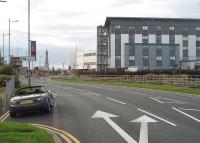 The large expanse of railway sidings that serviced Blackpool Central station until 1964 had long been known as Europe's largest car park, but in recent years has been improved and landscaped. This picture looks towards Central at the point where Bloomfield Road sidings were situated. The traffic lights mark the site of the former Bloomfield Road bridge that spanned the tracks and was only removed a few years ago. The white building is the home of Blackpool Football Club, back in the top flight in 2010/11 for the first time since 1971. [See image 30063] for a direct Then and Now comparison at the same location half a century earlier.<br><br>[Mark Bartlett 11/08/2010]