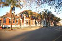 Station frontage at Ladysmith in the summer of 2010, complete with palm trees and evening sun. Ladysmith is an important junction, with connections to Cape Town, Durban and Pretoria. There has been a station here since 1886, although the present one was built later.<br><br>[John Gray 02/08/2010]