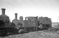 Two withdrawn veterans of Southampton Docks stand in a siding alongside Eastleigh shed in 1963. Adams B4 0-4-0T no 30089 was disposed of through the nearby works the following year, although USA  0-6-0T no 30065 fared better, being purchased for private preservation. The latter is now a resident on the Kent and East Sussex Railway. <br>
<br><br>[K A Gray 25/09/1963]