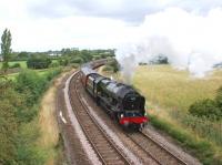 <I>The Fellsman</I> is currently a weekly service from Lancaster to <br>
Carlisle via Preston, Blackburn and the Settle & Carlisle line. On 11 August 2010 ex-LMS Royal Scot class 4-6-0 no 46115 <I>Scots Guardsman</I> climbs away from the WCML at Farington Curve Junction on the approach to Lostock Hall. After a troubled year <I>Scots Guardsman</I> has gone some way towards making amends for its earlier failures. As well as turning in a faultless performance on this train, the locomotive came to the rescue of the <I>Scarborough Spa Express</I> the following day with a sprint from Carnforth to Milford to take over from the temporary diesel substitute. Well done to <I>West Coast Railways</I> for what must be the most impressive <I>Thunderbird</I> run of the year.<br>
<br><br>[John McIntyre 11/08/2010]