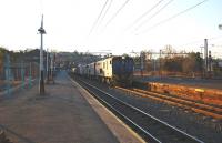 A fifty wagon late afternoon freight headed by three Class E18's in <I>Spoornet</I> livery passing south through Ladysmith in August 2010. The leading locomotive is no 18 109. South Africa's railway network is mainly 3ft 6in gauge. <br>
<br><br>[John Gray 02/08/2008]