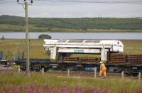 A sleeper laying train on the shore of Hillend reservoir on 16 August 2010; close-up of the transfer unit which lifts sleepers off the wagon and shuttles them to the front of the train<br>
<br><br>[Bill Roberton 16/08/2010]