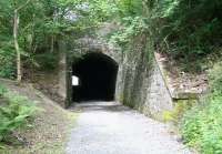 The south portal of Eshiels tunnel, on the eastern edge of Peebles, seen here on 1 August 2010. The 70 yard long, curved, single-track tunnel, brought the Peebles Railway east out of the town and under the A72 road on its way to Galashiels. The tunnel was sealed and the cutting forming the western approach infilled following closure of the line by BR in 1962. It was recently reopened (spring 2010) as part of a walkway / cycleway between Peebles and Innerleithen, with the project jointly funded by Sustrans and Scottish Borders Council.<br><br>[John Furnevel 01/08/2010]