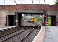 The 07.09 from Stranraer runs into Ayr on 29 July 2010. The passage under the bridge to the left used to lead to the south bay platforms, now a car park covers the area.<br><br>[Colin Miller 29/07/2010]