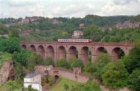 A local service crosses the Pulvermhle Viaduct, just to the north east of Luxembourg station, in 1991. View looks east. This viaduct is to be duplicated by a second viaduct due to projected increased traffic from the Kirchberg and Oetrange lines.<br><br>[Ewan Crawford 25/07/1991]