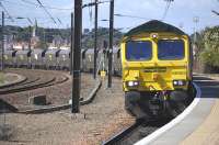 Freightliner 66953 is routed into the platform road at Dunbar on 20 August 2010. The train is the 6Z28 Leith Docks - Drax Power Station imported coal. The diversion is being carried out in order to facilitate a passing movement on the main line.<br><br>[Bill Roberton 20/08/2010]