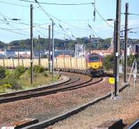 67021 leans into the curve at Dunbar as it nears its destination with the 6B45 Powderhall - Oxwellmains <i>Binliner</i> on 20 August 2010.<br><br>[Bill Roberton 20/08/2010]