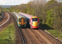 A Southern class 377 passing a down class 460 <I>Gatwick Express</I> service near Salfords in May 2005.<br><br>[Ian Dinmore /05/2005]