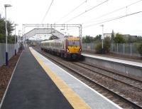 Paisley St James has recently reopened after a two-and-a-half month <br>
closure for refurbishment. 334 002 stands with a Gourock to Glasgow <br>
stopping service on 1 September as a semi-fast, which didn't stop, <br>
retreats.[See image 20078 for a comparison.] <br>
<br><br>[David Panton 01/09/2010]