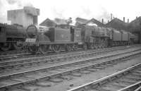 Scene in the yard at Kingmoor on 1 August 1959, with McIntosh ex-Caledonian 0-4-4T no 55234 and BR Standard class 9F 2-10-0 no 92152 amongst the locomotives on shed.<br><br>[Robin Barbour Collection (Courtesy Bruce McCartney) 01/08/1959]