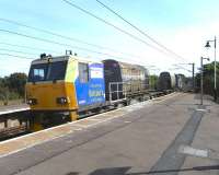 A Network Rail twin-tanked (and twin ended) maintenance vehicle <br>
passing north through Troon station on 1 September 2010. Seems a little early in the year for it to be on leaf blasting duties, so it is presumably operating as a weed-killing train on this occasion.<br><br>[David Panton 01/09/2010]