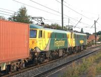 A southbound Freightliner container train with 86627 + 86637 passing <br>
through Leyland station on 3 September 2010. An interesting contrast between the old and new Freightliner liveries.<br>
<br><br>[John McIntyre 03/09/2010]