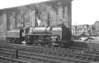 Britannia Pacific no 70039 <I>Sir Christopher Wren</I> stands alongside the west wall at the north end of Carlisle station in August 1964. One of several of the class to spend its final operational days at Carlisle, no 70039 was eventually withdrawn from Kingmoor shed in September 1967 and said its final goodbyes from the yard of Messrs McWilliams at Shettleston in January 1968.<br><br>[K A Gray 01/08/1964]