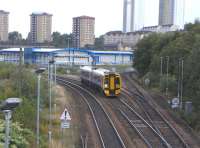 Against a backdrop of the high flats of Springburn 158 741 descends <br>
the Cowlairs incline on the last mile and a half to Queen Street on 11 September 2010. Going off to the right is the cord, opened in 1993, which finally allowed through running from Queen Street to Buchanan Street's old line, 27 years after Buchanan Street closed. Such were the consequences of Victorian competition in this part of the network.Though only 17 years old Cowlairs South Junction has already been renamed: it was initially called Pinkston Junction.<BR/><BR/>[<I>Editor's note: The photograph serves as a reminder that this month marks the 20th anniversary of the introduction of the Class 158s, when, following a protracted testing period, 158701 was launched into service during a photocall at Blair Atholl station in September 1990</I>]<br>
<br><br>[David Panton 11/09/2010]