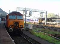 <I>Thunderbird</I> 57304 sits in the shaded bay at the north end of Platform 3 while 158791 leaves Platform 6 bathed in sunlight and heads for Blackpool North. <br><br>[Mark Bartlett 08/09/2010]