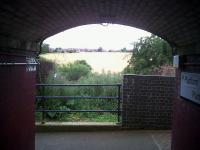 From the subway to the countryside - looking east from Long Buckby station subway in the summer of 2010.<br><br>[Ken Strachan 30/07/2010]