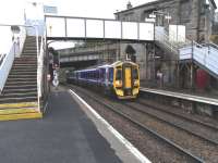 On 11 September 158 724 pulls into Springburn with a Falkirk <br>
Grahamston train. There is a half-hourly service on this line as far as Cumbernauld, with every other one going on to Falkirk. For some years there was no passenger service between Cumbernauld and Greenhill Lower Junction, apart from the odd diversion, but with a few exceptions all Grahamston trains now use this route.  The return working will see the feathers on the left-hand signal lit, indicating the road is set for the Cowlairs Cord and Glasgow Queen Street.<br><br>[David Panton 11/09/2010]