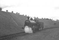 The 'Glasgow South Railtour' of 9 June 1962, with 57581 running round at Chapelhall - north end of the closed station. Although the line had continued on to Airdrie via Calderbank this had closed in the 1940s and the viaduct at Calderbank demolished (access to Chapelhall ironworks remained by reversal). After closure the line was accessed from the south along with the line to Duntilland (Dewshill) Colliery, amongst other sidings, from Bellside Junction at Cleland.<br><br>[K A Gray 09/06/1962]