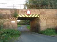 <I>Badger Bridge</I> was a well known WCML spotting location in steam days as it overlooked Brock water troughs. The badger is the emblem of the Fitzherbert-Brockholes family from nearby Claughton Hall. Less well known is this low bridge carrying the main line over Stubbins Lane, a little further north, but which also has four badger emblems on each side. <br><br>[Mark Bartlett 09/09/2010]