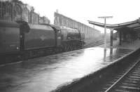 Stanier Pacific no 46225 <I>Duchess of Gloucester</I> runs into a rain soaked Carlisle station on 28 December 1963 with a down parcels train.<br><br>[Robin Barbour Collection (Courtesy Bruce McCartney) 28/12/1963]