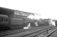 Black 5 no 45029 joins BR Standard Pacific no 72007 <I>Clan Mackintosh</I> on the 8am Aberdeen - Manchester train about to leave Carlisle in July 1964. The <I>Clan</I> had brought in the train from the north.<br><br>[K A Gray 18/07/1964]