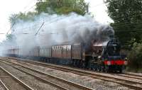 Creating quite a smokescreen as it travels north on the WCML just north of Euxton Balshaw Lane on 2 October, ex-LMS Jubilee no 5690 <I>Leander</I> heads the <I>Severn Valley Limited</I> railtour from Bridgnorth to Blackpool.<br><br>[John McIntyre 02/10/2010]