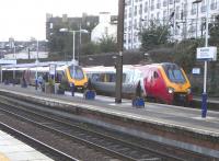 A pair of passing Class 220s makes a welcome change from the usual <br>
diet of ScotRail units at Haymarket on 2 October 2010. There's a handy alliteration in 'Virgin Voyager', with Voyager being the name of the class and not a Virgin brand per se. The name therefore applies equally to the Cross Country set on the left.<br>
<br><br>[David Panton 02/10/2010]
