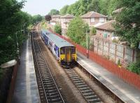 A Preston to Manchester and Hazel Grove service runs in to Lostock station past some of the new housing developments that made it viable to reopen the station after a long period of closure. 150275 is the unit in use in this view towards Chorley and Preston. <br><br>[Mark Bartlett 26/06/2010]