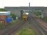 View south at Barassie on 27 July 2010 as the 11.07 Kilmarnock to Girvan negotiates the junction. Signal box to the left<br>
<br><br>[Colin Miller 27/07/2010]