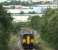 A Manchester Victoria to Clitheroe service in the hands of 150273 <br>
drifts downhill between Darwen and Blackburn near to the site of the former Hoddlesden Junction and Lower Darwen engine shed on 31 July 2010. <br>
<br><br>[John McIntyre 31/07/2010]