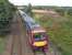 The course of the 'Dubbie Shunt' can just be made out on the far right as 170 476 heads south at speed, about to pass the site of Dysart station in August 2010.  This short branch served the Frances Colliery, which was known locally as 'The Dubbie' after a sea-facing brae - which was ruined by the sinking of the pit!<br><br>[David Panton 21/08/2010]