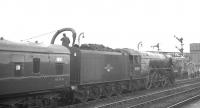 The RCTS <i>Tyne-Solway Rail Tour</i> from Leeds City stands at Stockton in March 1965 as A1 Pacific no 60131 <I>Osprey</I> takes on water. The railtour ran from Leeds City to Carlisle via Newcastle, returning via the Settle & Carlisle line.<br><br>[K A Gray 21/03/1965]