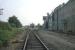 The view south through Ryburgh station, Norfolk on 9th September 1979. Located on the Wymondham-Wells branch, it was then still open for grain traffic from the granary and sidings on the right. The view from the same spot today would be pitch black - you'd be standing in the middle of a silo that has since been built across the trackbed!<br><br>[Mark Dufton 09/09/1979]