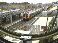 <I>Shiver me timbers!</I> A Southbound 350 seen through one of the unusual 'porthole' windows on the footbridge at Milton Keynes on 27 August.<br><br>[Ken Strachan 27/08/2010]