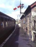 The 4.51pm train to Dumfries taking water at Kirkcudbright terminus just two weeks before the end of passenger services on the branch. Closure came on 3rd May 1965.<br><br>[Frank Spaven Collection (Courtesy David Spaven) /04/1965]