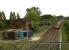 This former WCML station is just behind Watford Gap services on the M1. The modern, fast, large, and well maintained Pendo contrasts first with the small and slow track inspection carts, and secondly with the old-fashioned and distinctly under-maintained goods shed. With gaps in the roof and a tree growing out one window, it just doesn't look loved.<br><br>[Ken Strachan 17/09/2010]