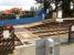 The soon to be replaced foot crossing at Woodlesford Station seen from the down platform, with preparation work for the new footbridge installation visible across the line. Klaxons and voice warnings have been added here recently to supplement the red stop lights.<br><br>[David Pesterfield 18/09/2010]