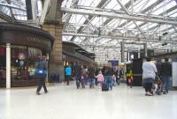 The Ayrshire lines platforms at the west side of Glasgow Central are <br>
set further back than Platforms 1 to 11 and passengers are funnelled <br>
along a stretch of the concourse also used by people on their way to and from the Low Level platforms and the Argyle Street entrance. It can therefore get rather busy, and going against the flow at peak times can be a challenge. Fairly quiet here though on 16 October.<br>
<br><br>[David Panton 16/10/2010]