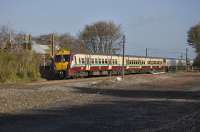 A pair of 334 units head for Edinburgh past the remains of Drumshoreland Station.<br><br>[Bill Roberton 02/11/2010]