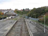 From the footbridge, the remainder of the platform and the island platform are visible, together with a DMU on the Barry Steam Railway tracks. Note the remaining colour light signals!<br><br>[John Thorn 28/10/2010]