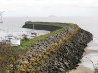 The railway used to continue to Barry Pier where trains would meet the paddle steamers from Weston-super-Mare and other ports across the Bristol Channel. The tracks are just visible on the breakwater in October 2010; the island in the background is Steep Holm.<br><br>[John Thorn 28/10/2010]